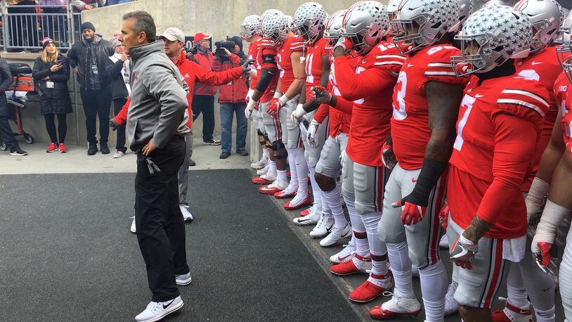 Ohio State’s Urban Meyer waits to lead the team onto the field before a game against Michigan State on Saturday, Nov. 11, 2017, at Ohio Stadium in Columbus. David Jablonski/Staff