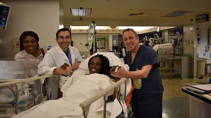 Thelma Chiaka with (L to R) relative Ebere Ofor, Dr. Ziad Haidar-Perinatologist who delivered the babies and Dr. Israel Simchowit-Neonatologist , both on staff at The Woman's Hospital of Texas.