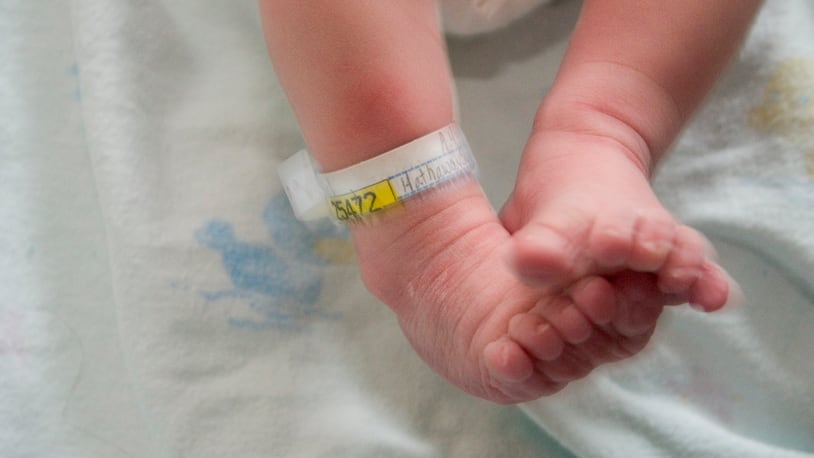 The feet of a newborn baby.