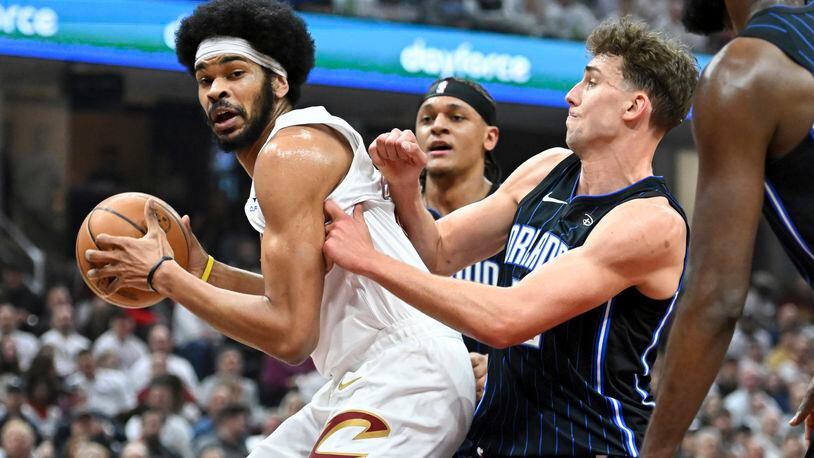 Cleveland Cavaliers' Jarrett Allen drives against Orlando Magic's Franz Wagner during the first half in Game 1 of an NBA basketball first-round playoff series, Saturday, April 20, 2024, in Cleveland. (AP Photo/Nick Cammett)