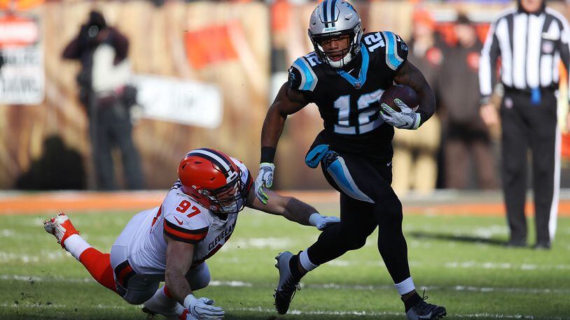CLEVELAND, OH - DECEMBER 09: D.J. Moore #12 of the Carolina Panthers carries the ball in front of Anthony Zettel #97 of the Cleveland Browns during the second quarter at FirstEnergy Stadium on December 9, 2018 in Cleveland, Ohio. (Photo by Gregory Shamus/Getty Images)