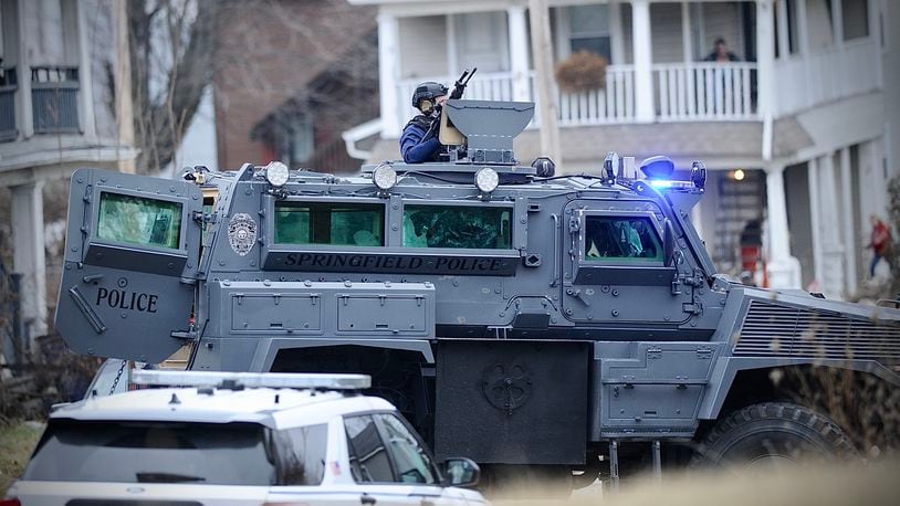 Members of the Springfield Police Division's Special Response Team prepared to enter a house on South Race Street looking for a shooting suspect Monday, Jan. 2, 2023. MARSHALL GORBY \STAFF