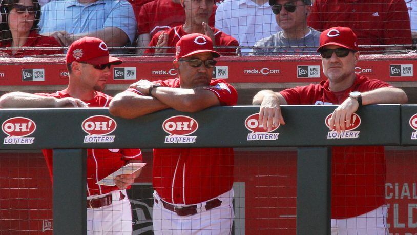 Reds manager David Bell, right, watches the final home game of the season on Thursday, Sept. 26, 2019, at Great American Ball Park in Cincinnati.