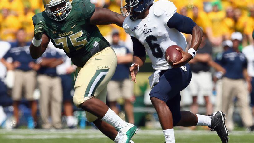 Bengals defensive tackle Andrew Billings, seen here as a Baylor Bear tracking Rice's Driphus Jackson in a 2015 game,  missed his rookie season of 2016 with a knee injury.
