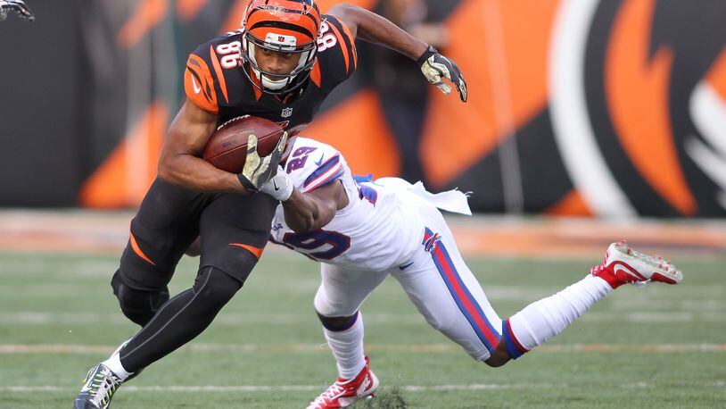 CINCINNATI, OH - NOVEMBER 20: James Wright #86 of the Cincinnati Bengals breaks a tackle by Kevon Seymour #29 of the Buffalo Bills during the first quarter at Paul Brown Stadium on November 20, 2016 in Cincinnati, Ohio. (Photo by John Grieshop/Getty Images)