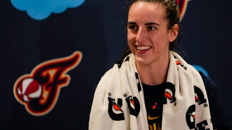 Indiana Fever guard Caitlin Clark speaks with the media after the WNBA basketball team practiced in Indianapolis, Sunday, April 28, 2024. (AP Photo/Michael Conroy)