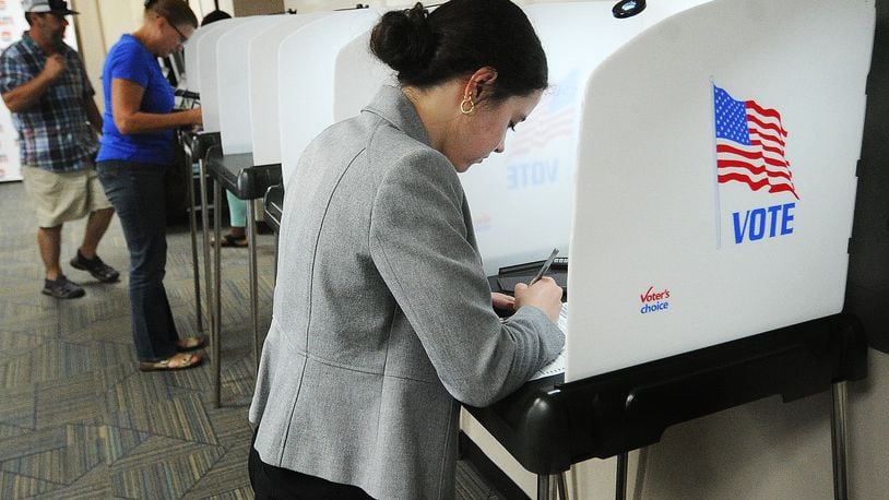 In summer 2023, at the Miami County board of elections office, Maddie Logan votes on a statewide ballot issue that would have made it harder for Ohioans to change the state constitution via citizen petition. That ballot issue was rejected. MARSHALL GORBY\STAFF