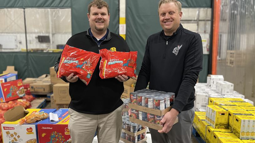 The Clark-Shawnee Local School District has challenged the Greenon Local School District to a canned food drive competition. The competition will run from Dec. 4-8 in both districts, in which all canned food donated by students and staff will be given to the Second Harvest Food Bank. Clark-Shawnee Superintendent Brian Kuhn, left, is shown with Greenon Superintendent Darrin Knapke. CONTRIBUTED