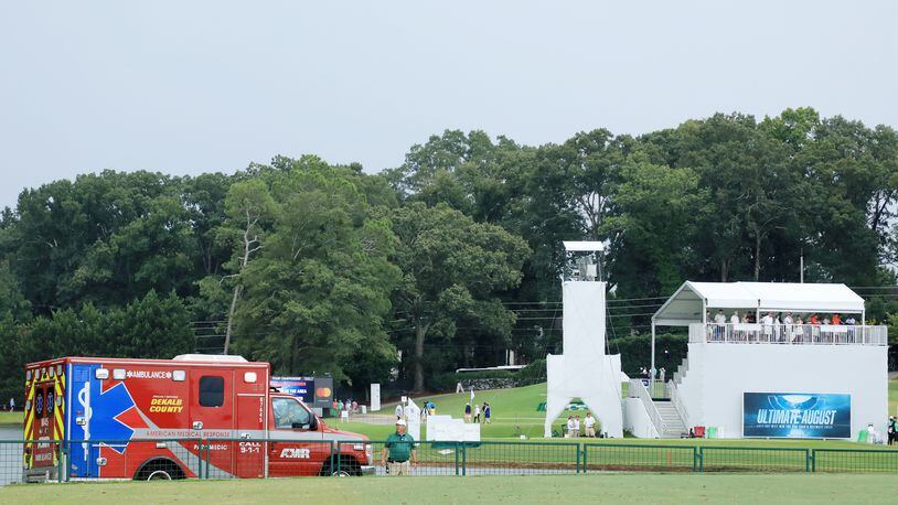 An ambulance arrives to provide medical assistance after a lightning strike during a suspension of the third round Saturday due to inclement weather of the Tour Championship at East Lake Golf Club.