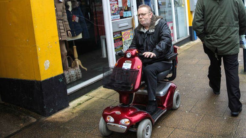 A man rides a mobility scooter Feb. 7, 2017, in Great Yarmouth, United Kingdom.