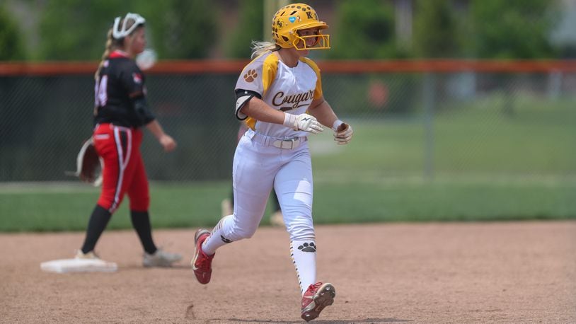 Kenton Ridge High School senior Kirsten Wright celebrates after hitting a home run during a Division II district final game against Franklin on Friday, May 19 at Arcanum High School. The Cougars won 11-0 in five innings. CONTRIBUTED PHOTO BY MICHAEL COOPER