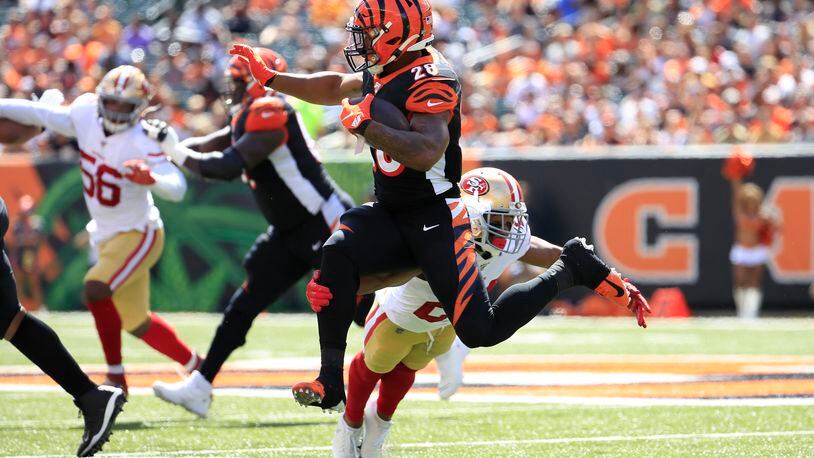 CINCINNATI, OHIO - SEPTEMBER 15: Joe Mixon #28 of the Cincinnati Bengals runs with the ball while defended by K’Waun Williams #24 of the San Francisco 49ers at Paul Brown Stadium on September 15, 2019 in Cincinnati, Ohio. (Photo by Andy Lyons/Getty Images)