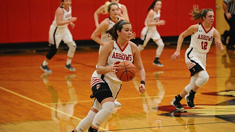 Tecumseh senior Corinne Thomas (center) leads an Arrows’ fastbreak with senior Mackenzie Pauley (12) and senior Presley Griffitts (behind Thomas) trailing the play. Greg Billing / Contributed