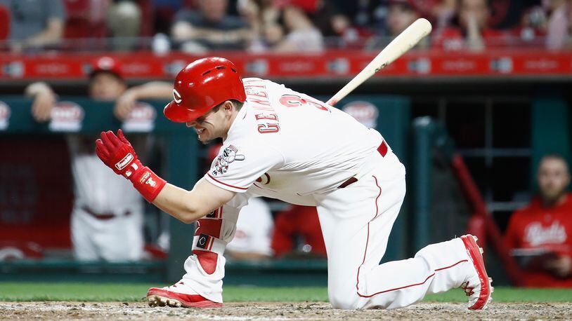 CINCINNATI, OH - APRIL 13: Scooter Gennett #3 of the Cincinnati Reds swings and misses at a pitch in the eighth inning against the St. Louis Cardinals at Great American Ball Park on April 13, 2018 in Cincinnati, Ohio. (Photo by Andy Lyons/Getty Images)