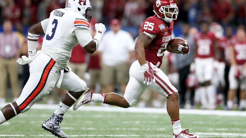 Joe Mixon  hasn't even worn a Bengals uniform yet, but there are plenty of fantasy football pundits who believe the rookie from Oklahoma should be the first running back chosen from Cincinnati's roster.  Here, he's running away from the Auburn Tigers in the AllState Sugar Bowl.