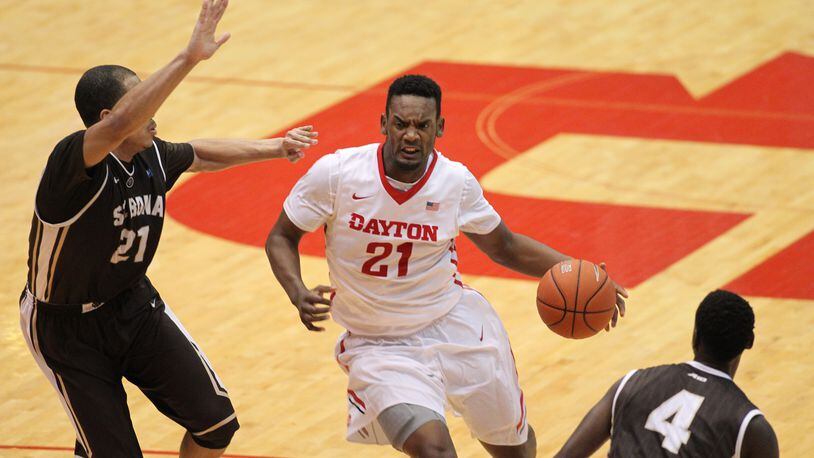 Dayton’s Dyshawn Pierre drives to the basket against St. Bonaventure’s Dion Wright on Saturday, Feb. 20, 2016, at UD Arena in Dayton. David Jablonski/Staff