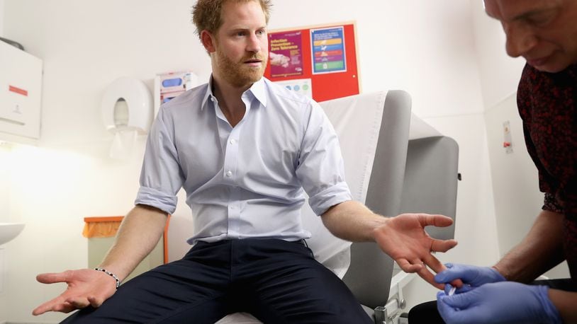 LONDON, ENGLAND - JULY 14: Prince Harry has blood taken by Specialist Psychotherapist Robert Palmer as he takes an HIV test during a visit to Burrell Street Sexual Health Clinic on July 14, 2016 in London, England. Prince Harry was visiting the clinic, run by Guy's and St Thomas NHS Foundation to promote the importance of getting tested for HIV and other STDs. (Photo by Chris Jackson/Getty Images)
