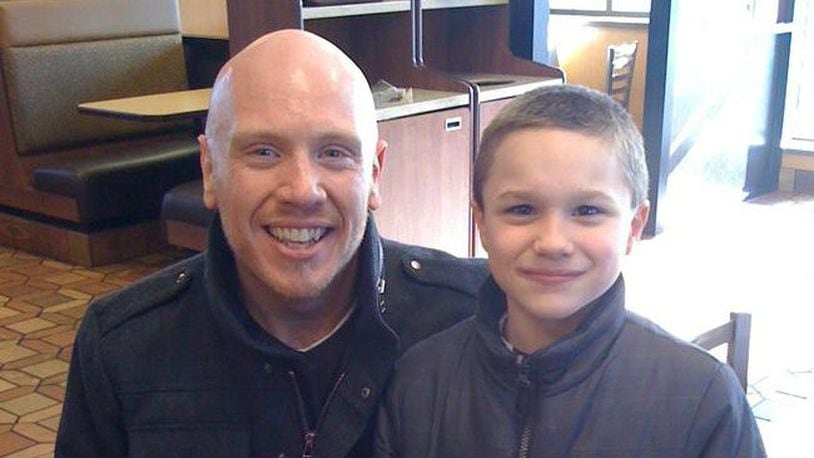 Brian Buttrey and his son Zach in 2010, before Zach was officially adopted. CONTRIBUTED