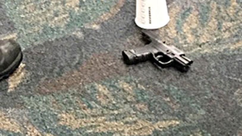 In this image taken Friday, Jan. 6, 2017 and made available by Mark Lea, shows the pistol of alleged shooter Esteban Santiago at the Ft. Lauderdale-Hollywood International Airport. Santiago opened fire in the baggage claim area killing five travelers. (Mark Lea via AP)