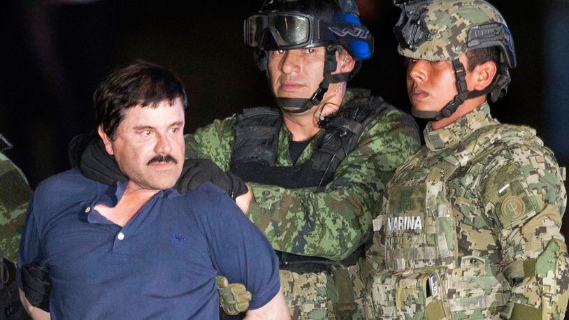 FILE - In this Jan. 8, 2016 file photo, Joaquin "El Chapo" Guzman is made to face the press as he is escorted to a helicopter in handcuffs by Mexican soldiers and marines at a federal hangar in Mexico City, Mexico, following his recapture six months after escaping from a maximum security prison. Guzman's lawyers said Friday, Feb. 19, 2016 he told them that guards at Mexico’s Altiplano prison won’t let him sleep, and that plans to make a movie about his life with Mexican actress Kate del Castillo are still on. (AP Photo/Eduardo Verdugo, File)