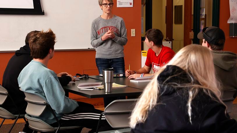 Wittenberg University has extended its new tuition-free program for eligible Ohio residents to include transfer students. Here, Amy McGuffey teaches a sociological perspectives of education class at Wittenberg University. BILL LACKEY/STAFF