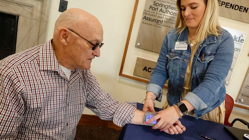 Marvin Conley gets his blood pressure checked by Taylor Reis at United Senior Services in Springfield Wednesday, April 19, 2023. BILL LACKEY/STAFF
