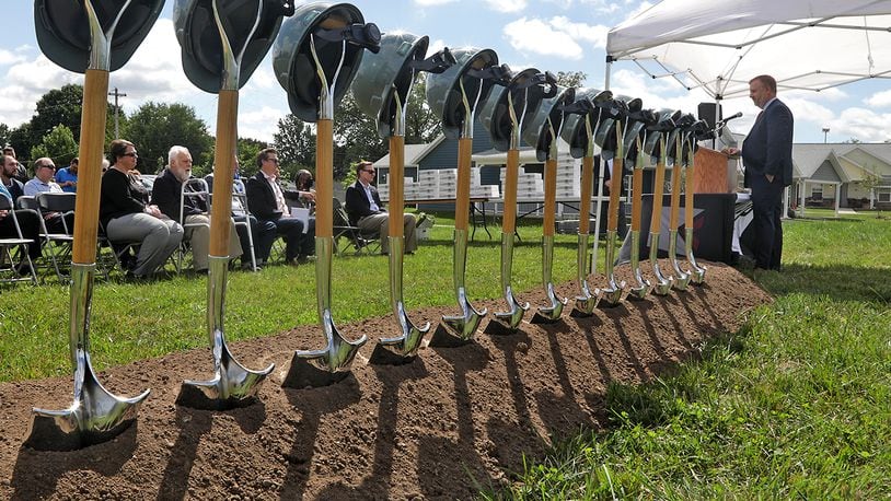 Ian Maute, from Buckeye Community Hope Foundation, speaks during the groundbreaking celebration for the next phase of The Community Gardens Tuesday, Sept. 13, 2022 in Springfield. BILL LACKEY/STAFF