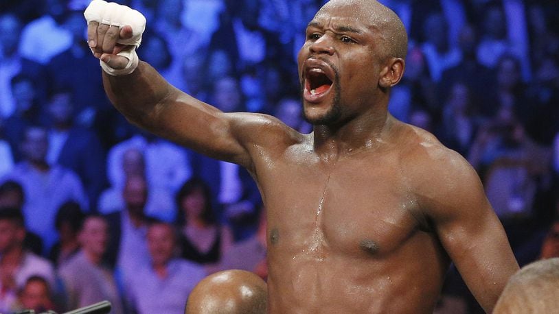 Floyd Mayweather Jr. celebrates his unanimous decision victory over Manny Pacquiao, from the Philippines, at the finish of their welterweight title fight on May 2, 2015, in Las Vegas.
