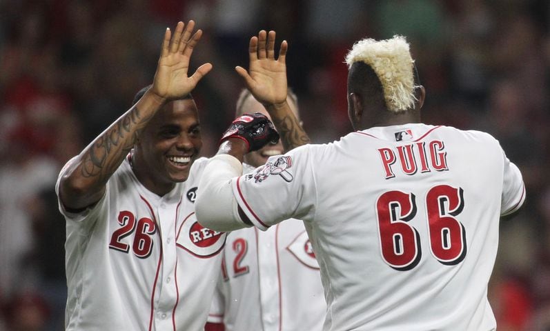 Photos: Reds beat Brewers on wild play in 11th