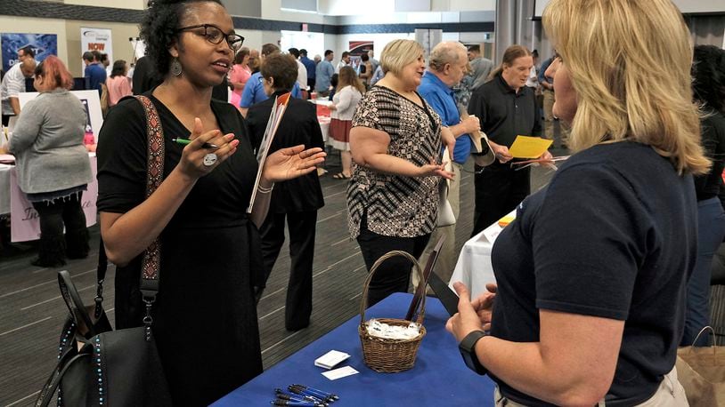 Ashley Clarke, left, talks to Darlene Carpenter, from Cascade Corp., during the Clark County Job Fair at the Hollenbeck-Bayley Conference Center in 2017. Bill Lackey/Staff