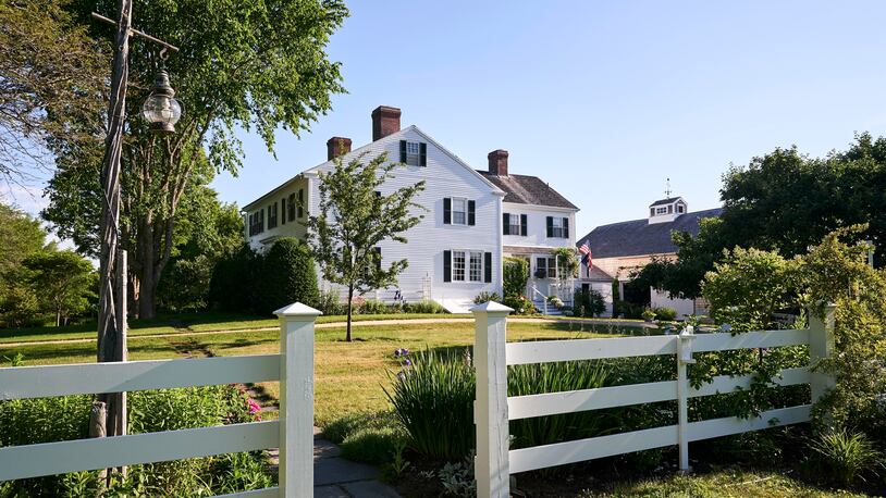 This July, 13, 2017, photo provided by Yankee Magazine shows an oceanfront home where E.B. White lived when he penned "Charlotte's Web." The home where White lived until his death in 1985 dates to the late 1700s and includes a barn that was the setting for the beloved children's book featuring a pig named Wilbur and a spider named Charlotte. (Mark Fleming/Yankee Magazine via AP)