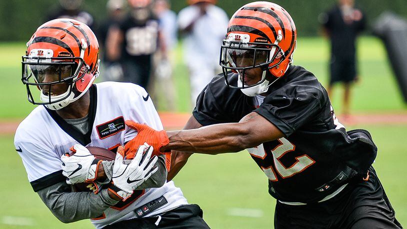 Bengals’ wide receiver John Ross catches a pass defended by cornerback William Jackson during organized team activities Tuesday, May 22 at the practice facility near Paul Brown Stadium in Cincinnati. NICK GRAHAM/STAFF