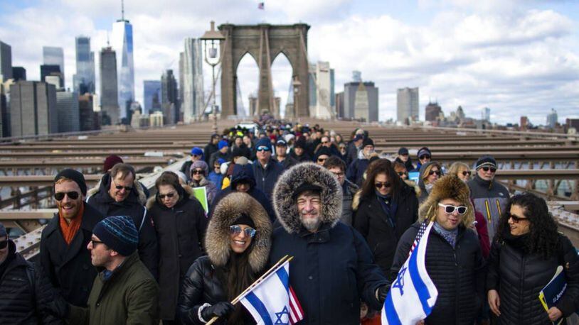 People marched across the Brooklyn Bridge on Sunday to show support for New York City's Jewish community.