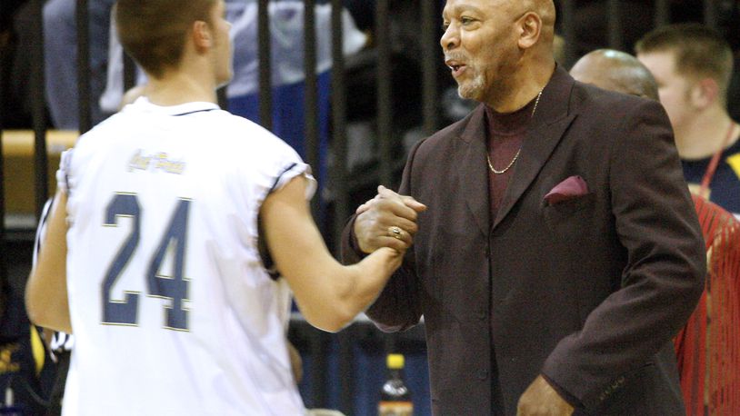 Former South High School basketball coach Larry Ham greets one of his ex-players Lucas Smith before a 2007 game against Trotwood-Madison High School, that team that Ham coached at that time. Staff Photo by Barbara J. Perenic