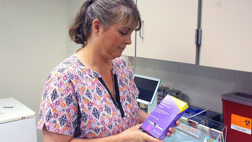Clark County Combined Health District RN Patricia Free shows one of the Hepatitis A vaccines that are available. Clark County has seen a 70 percent increase this year in Hepatitis A. JEFF GUERINI/STAFF