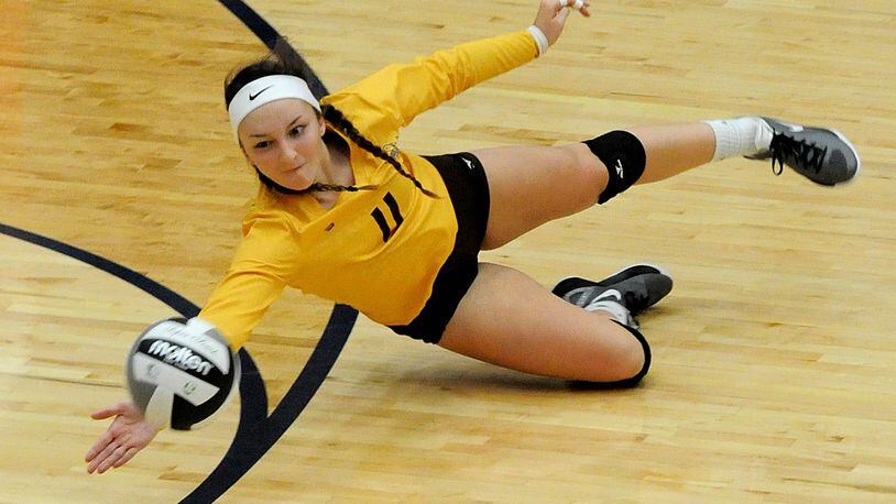 Kenton Ridge’s Dakota White, 11, makes a diving save duriing a Division II District Volleyball title match against Middletown Fenwick at Kettering Fairmont’s Trent Arena on Saturday, Oct. 30, 2016. David A. Moodie, contributing photographer