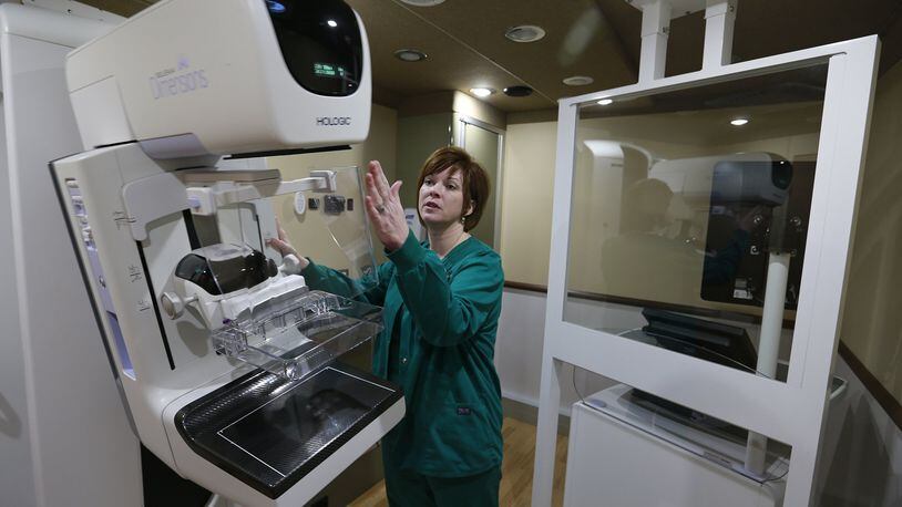 Selena Kemper, supervisor of the Mammography Department Community Mercy Health Partners, talks about the 3D mammography machine in the new Mobile Mammography Unit earlier this year. BILL LACKEY/STAFF