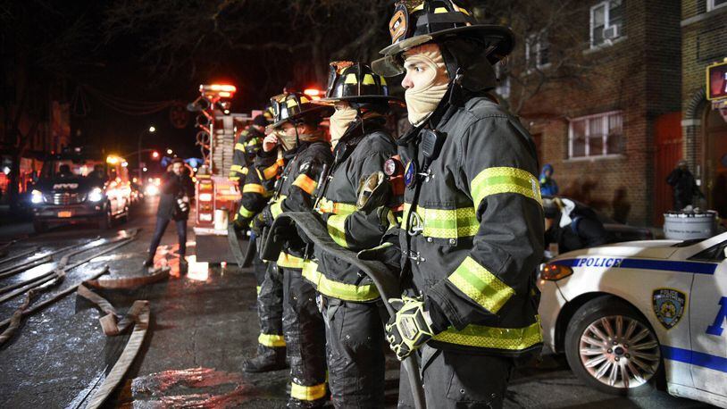 Firefighters at the scene of a deadly fire on in New York last December. A bill that passed the U.S. Senate last week would create a voluntary database of firefighters who contract cancer. The House approved a similar version of the bill last year. (David Dee Delgado/The New York Times)