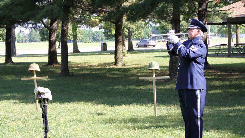 Taps was played May 26, 2016, by bugler Tech. Sgt. Cheryl Przytula, Air Force Band of Flight, during the 2016 Roll Call Memorial Service in the outdoor Memorial Park at the National Museum of the U.S. Air Force at Wright-Patterson Air Force Base. This year’s ceremony is at 9 a.m. May 23 and is open to the public. (U.S. Air Force photo/Ted Pitts)