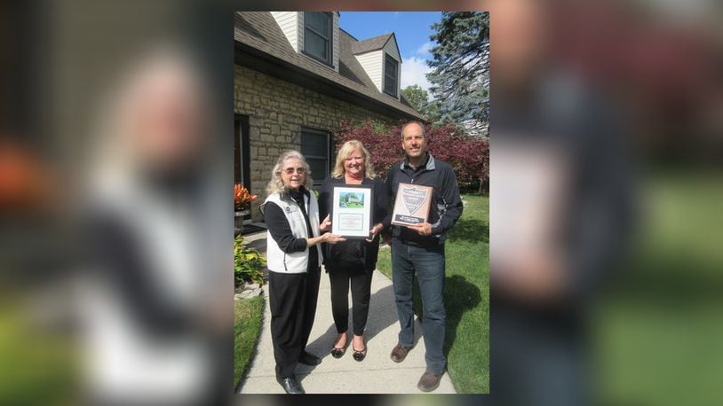 Home of the Year winners Paul and Laura Maletic receiving their awards from CBC Chairman Marianne Nave. CONTRIBUTED