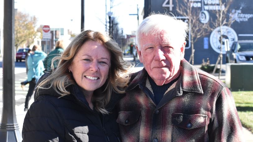 Katy Hazen (left), who was visiting from Kansas City and is originally from Springfield, with Jack Lilienthal, of Springfield. Hazen and Lilienthal were in downtown Dayton on Sunday after leaving St. Joseph's Parish. SAMANTHA WILDOW\STAFF