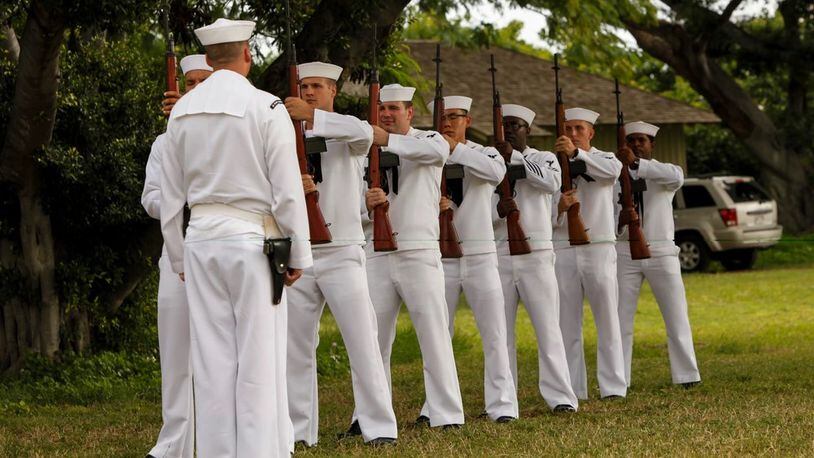 The Navy Region Hawaii Honors and Ceremonies Detachment performs an honors volley during the National Park Service annual USS Oklahoma Memorial Ceremony on Ford Island, Hawaii, Dec. 7, 2015. The USS Oklahoma Memorial honors the 429 men killed aboard Oklahoma Dec. 7, 1941. (U.S. Marine Corps Photo by Lance Cpl. Maximiliano Rosas/Released)