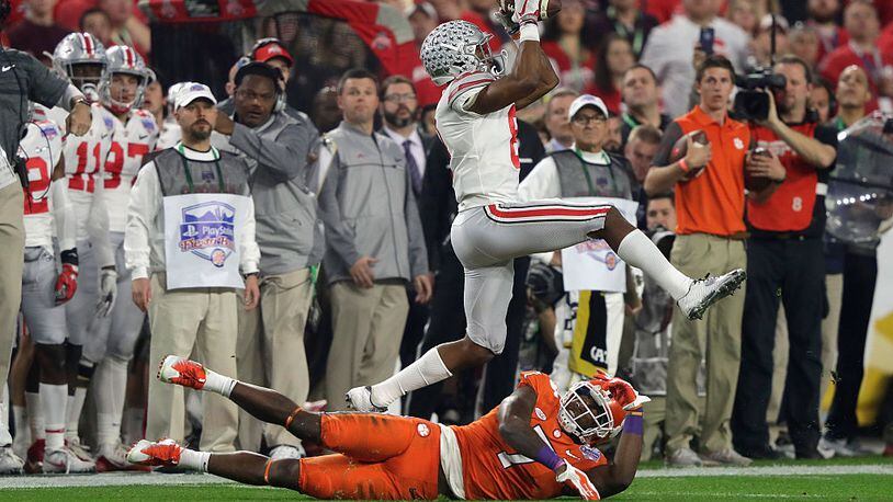 GLENDALE, AZ - DECEMBER 31: Gareon Conley #8 of the Ohio State Buckeyes intercepts a pass intended for Mike Williams #7 of the Clemson Tigers during the first half of the 2016 PlayStation Fiesta Bowl at University of Phoenix Stadium on December 31, 2016 in Glendale, Arizona. (Photo by Jamie Squire/Getty Images)