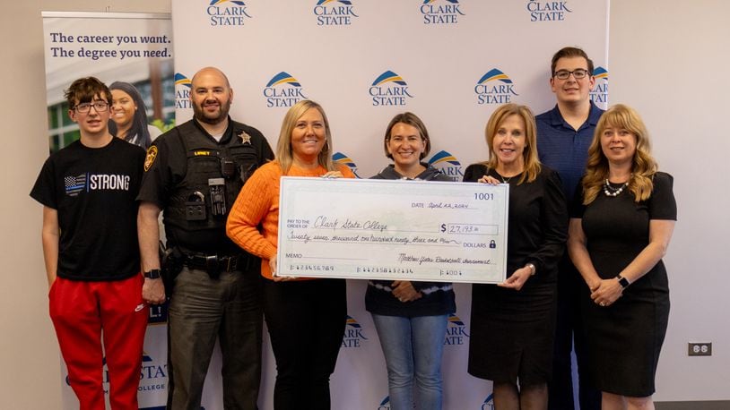 Organizers of the Matthew Yates Memorial Basketball Tournament presented Clark State College with a donation of more than $27,000 to help students pursuing careers in law enforcement and mental health. Pictured (left to right) are Jacob Loney; Deputy Johnny Loney; Tracy Yates, Matthew’s wife; Amanda Loney; Clark State President Jo Alice Blondin; Caleb Loney; and Toni Overholser, Clark State Vice President of Advancement and Outreach. Contributed