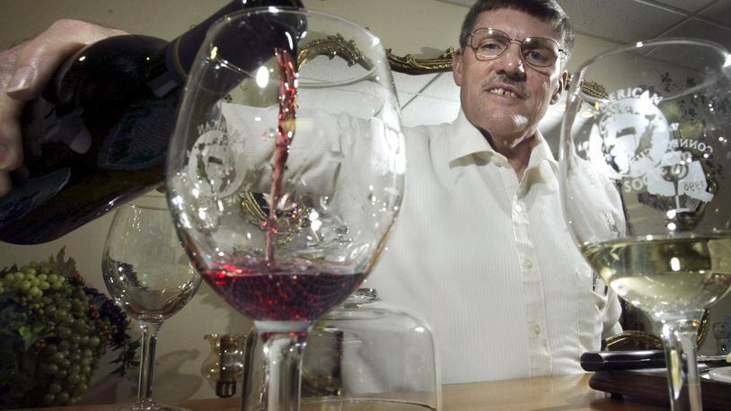 In this file photo from 2005, James Brandeberry pours a glass of his cabernet sauvignon.