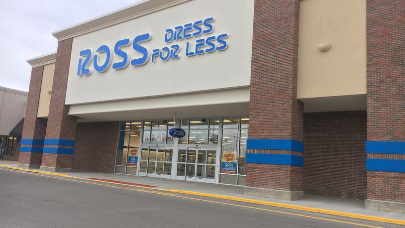 A large hiring sign and other “Coming Soon” signs are posted outside the Ross Dress For Less store in Beavercreek. STAFF PHOTO / HOLLY SHIVELY