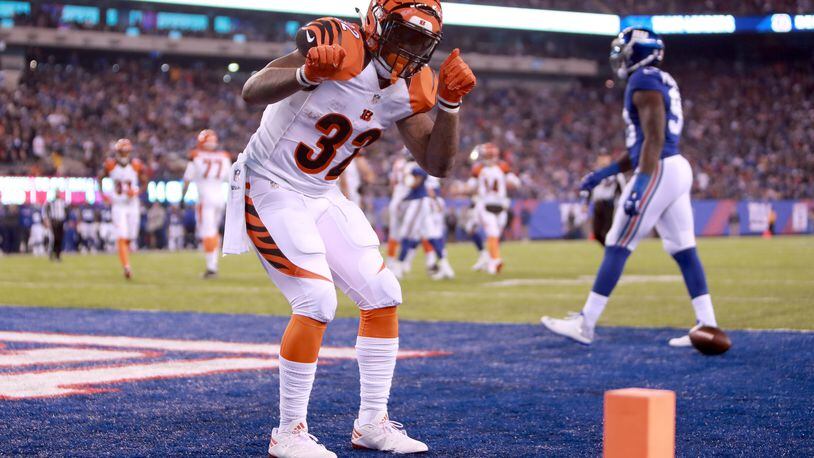 EAST RUTHERFORD, NJ - NOVEMBER 14: Jeremy Hill #32 of the Cincinnati Bengals celebrates after scoring a 9 yard touchdown against the New York Giants during the third quarter of the game at MetLife Stadium on November 14, 2016 in East Rutherford, New Jersey. (Photo by Michael Reaves/Getty Images)