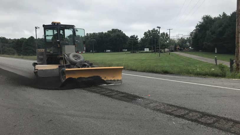 Ohio department of transportation installs rumble strips on roads to keep drivers from weaving into wrong lanes.