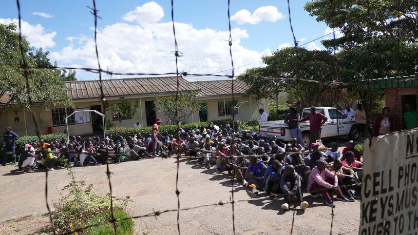 Prisoners gather inside Chikurubi Maximum prison before their release on the outskirts of the capital Harare, Thursday, April 18, 2024. Zimbabwe President Emmerson Mnangagwa has granted amnesty to more than 4,000 prisoners in an independence day amnesty. The amnesty coincided with the country's 44th anniversary of independence from white minority rule on Thursday and included some prisoners who were on death row. (AP Photo/Tsvangirayi Mukwazhi)