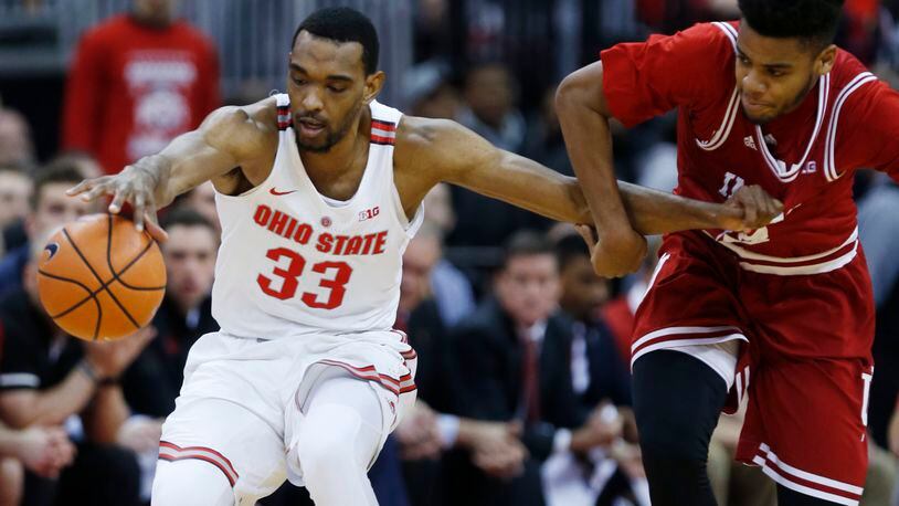Ohio State forward Keita Bates-Diop, left, chases a loose ball against Indiana forward Juwan Morgan during the first half of an NCAA college basketball game in Columbus, Ohio, Tuesday, Jan. 30, 2018. (AP Photo/Paul Vernon)